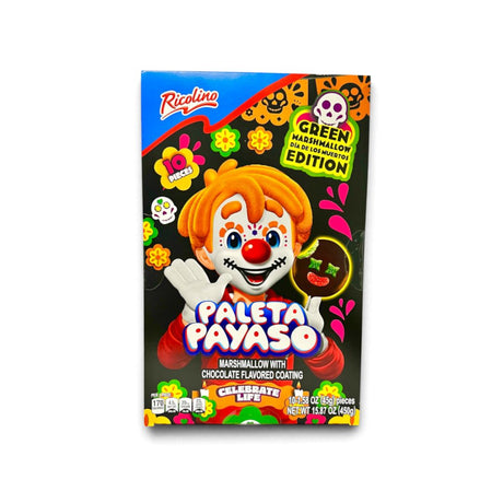A box of Ricolino Paleta Payaso marshmallow candy with chocolate flavored coating, featuring a festive clown illustration on a black background with colorful decorative graphics.