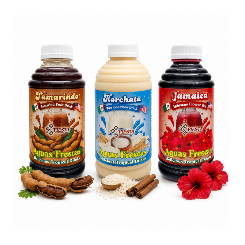Three bottles of FIESTA brand tropical aguas frescas drinks arranged on a white background with decorative ingredients: peanuts, cinnamon sticks, rice, and red hibiscus flowers. The bottles are labeled Tamarindo, Florchata, and Jamaica.